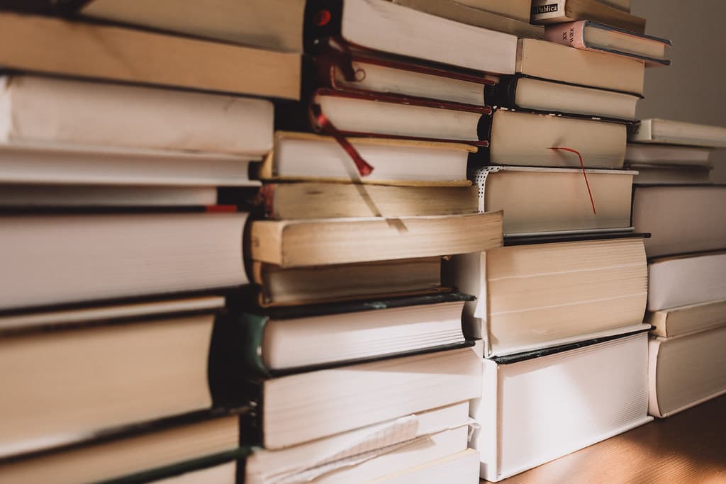 Stacks of books from a library being cleared out