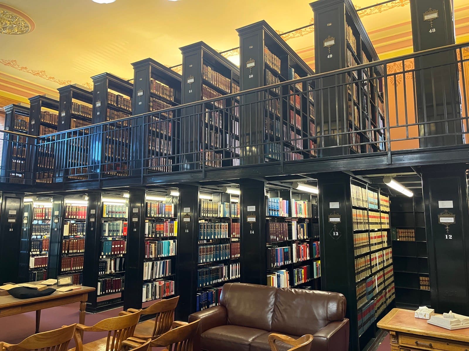 Tall aisles of academic library stacks